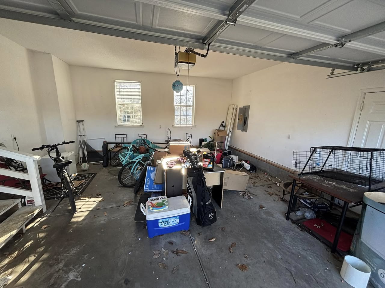 Cluttered garage before cleanout