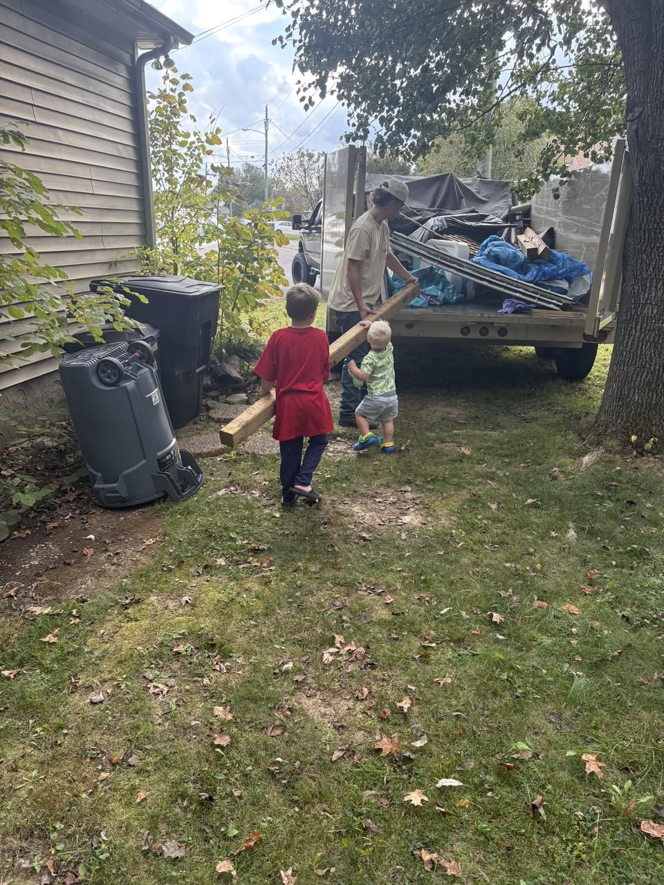 Lawson and kids loading lumber on a job - Trash Titans