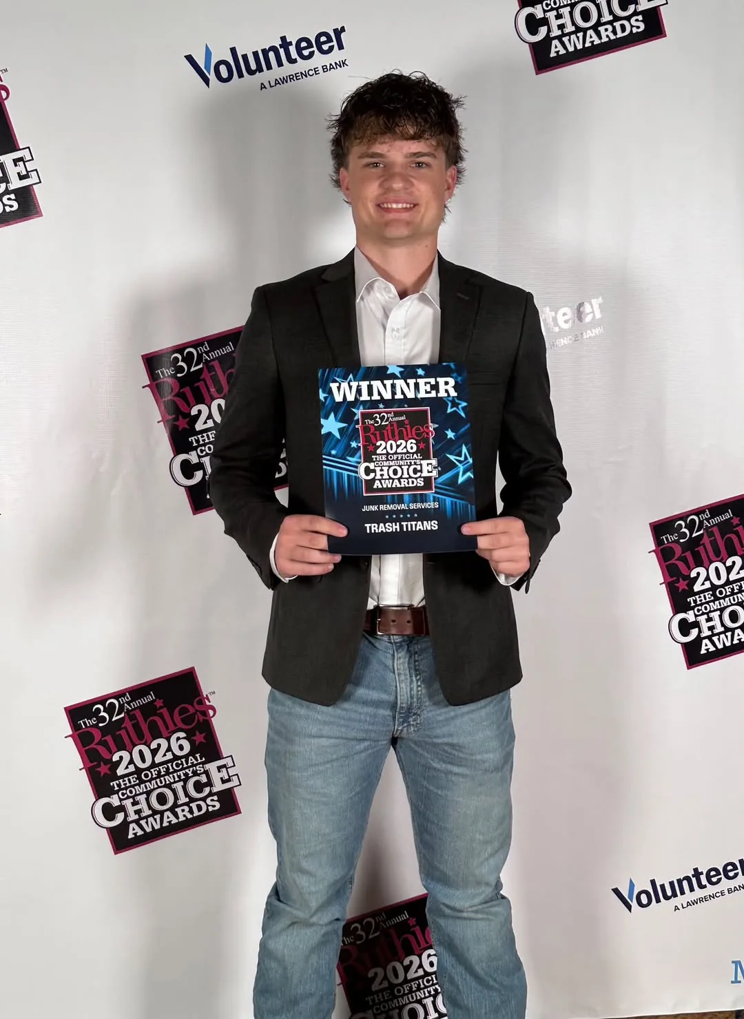 Lawson Gregory holding the 2026 Ruthies WINNER sign for Junk Removal Services, Rutherford County TN